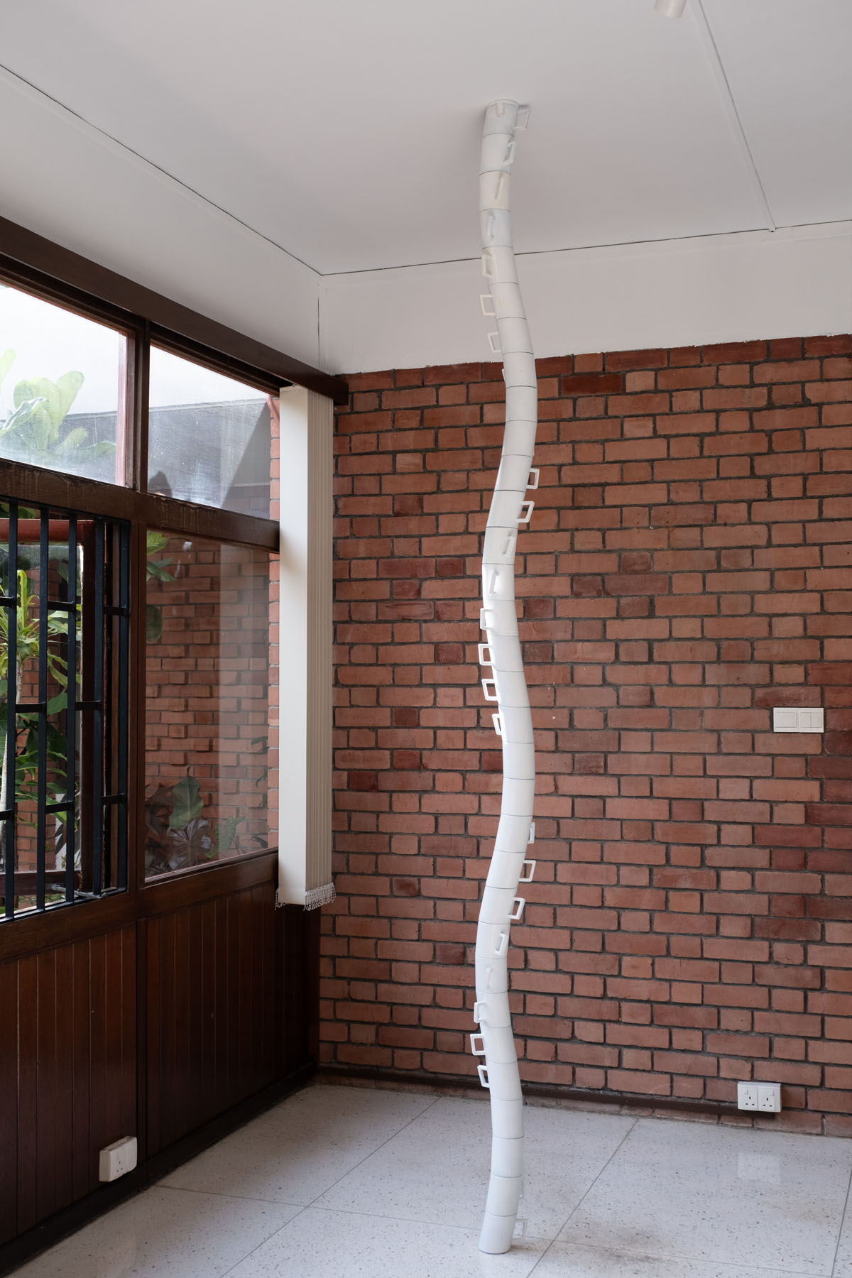 <p><em>Coffee Cups (the weight on your spine)</em> (2024), 3D-printed installation by Mike HJ Chang.</p>
