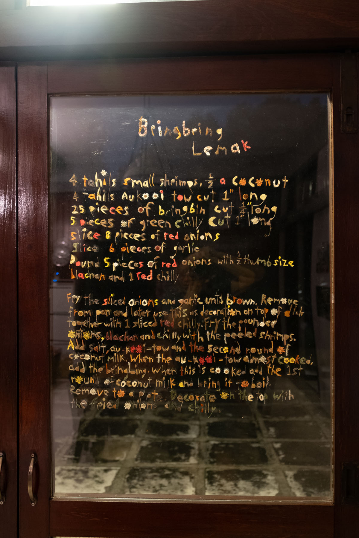 <p><em>Bringbring Lemak</em>  (2024), Pressed flowers,<br />
leaves, adhesive, acrylic sheet 104.8 by<br />
72.3 cm by Susanna Tan.</p>
