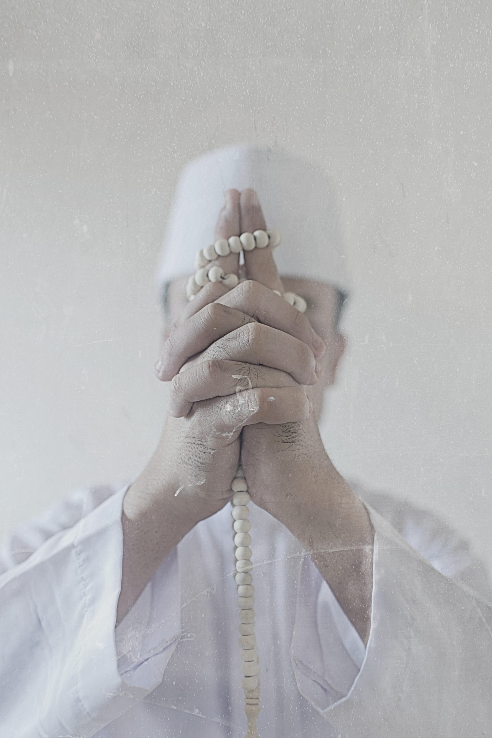 <p>Image from the sereis <em>Noor</em></p>
<p><em>Exit/Exist</em> is part of a larger series entitled <em>Noor</em>.  This narrative manifested through the artist desire to have a more intimate, emotional variant to the installation, to thread all the strings together. As the title suggests, the series speaks of that ambiguity between leaving and living. The artist want this section to be an externalization of the disquietude stirring within him.One where there is a struggle in reclaiming his identity. He holds the belief that the Self is dissipating, hence the 6 image piece, follows a narrative of losing the face.</p>
<p>Aside from putting forth this feeling of decadence, it crosses a dangerous supposition on the turbulence of finding faith. In today’s age, the artist posited that the distortion and fabrication of truths creates a perplexity in the spirituality of oneself. He feels that there is always that transition phase where the real does not seem as it is and the Self gets trapped in that in-between territory. This series proposes a deep, introspective vision of Home. A sanctuary within the soul, in this sense, an intimate intermingling of faith and the Self. Of seeking solace, of seeking shelter, of seeking Home.</p>
