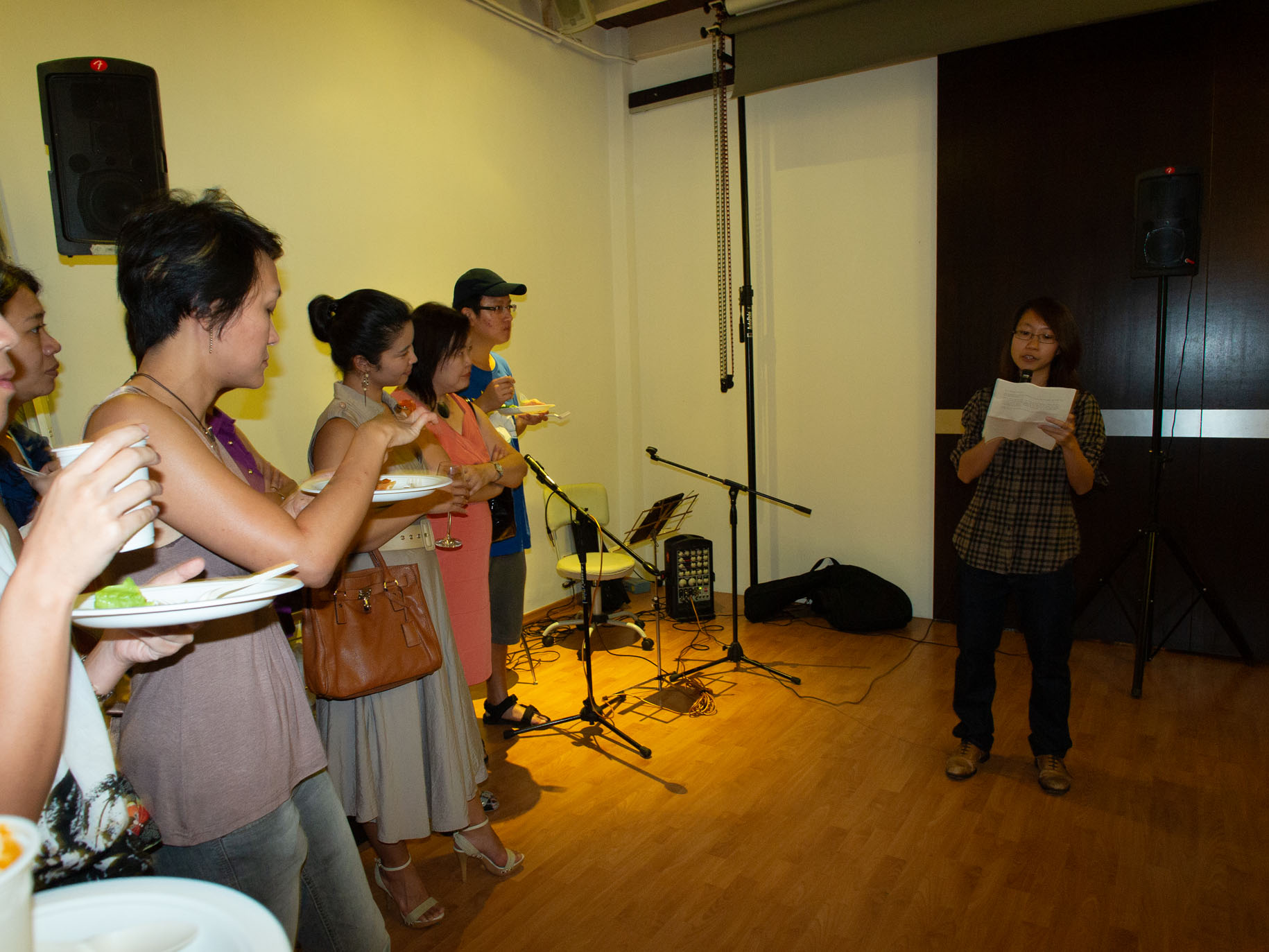 <p>Launch of Photovoice SG at The Pond studio. Jennifer Koh is giving a speech.</p>
